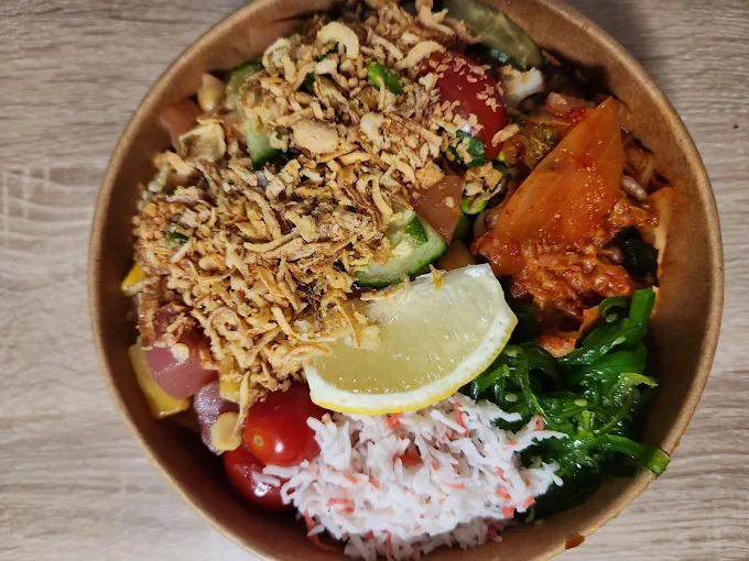 Poke Bowl - Fresh salmon and tuna with rice, vegetables, and signature sauces